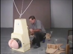 BDSM encased slave tortured with only his big ass free