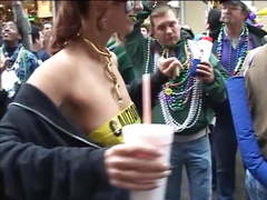 Chicks at Mardi Gras flash boobs and butts