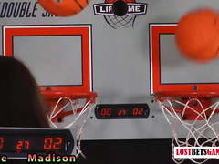 Two adorable girls play a game of strip basketball shootout