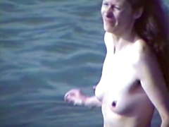 Topless with hard nipples at the beach