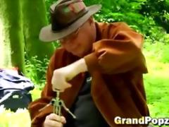 Nasty grandpa fucks a young slut in the woods